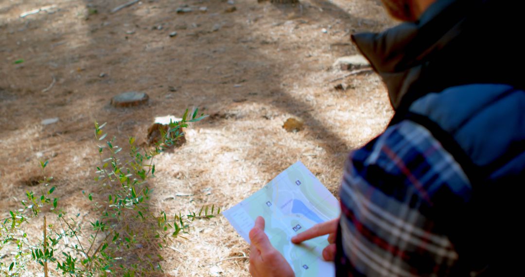 Hiker Navigating Trail in Forest Using Map for Guidance - Free Images, Stock Photos and Pictures on Pikwizard.com