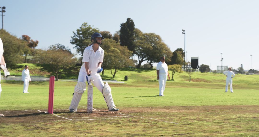 Cricket Batsman in Action on Sunny Day at Pitch