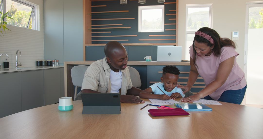 Parents Assisting Young Son with Homework in Modern Kitchen