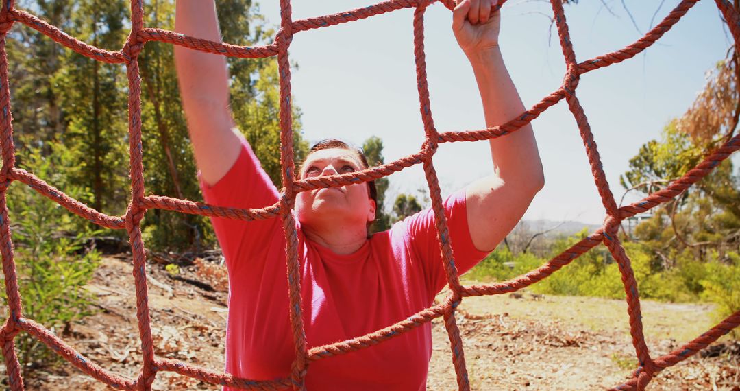 Determined Man Climbing Outdoor Obstacle Course Rope Net - Free Images, Stock Photos and Pictures on Pikwizard.com