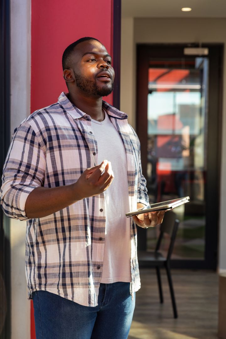Businessman Analyzing Data in Modern Office Lobby