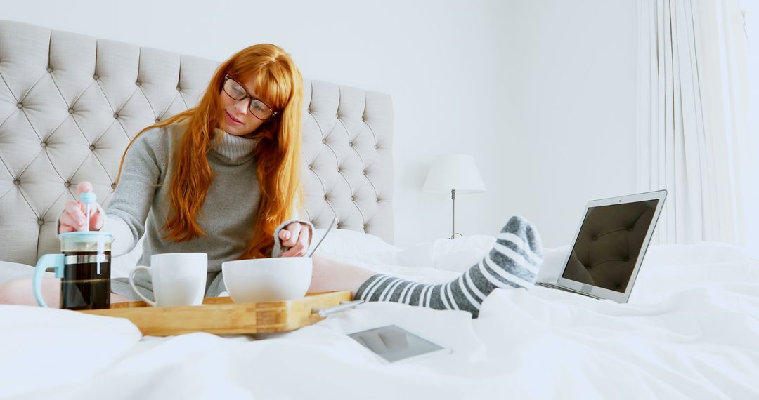 Woman Having Breakfast in Bed with Laptop and Tablet - Free Images, Stock Photos and Pictures on Pikwizard.com