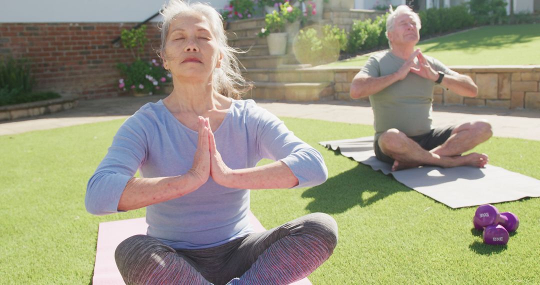 Senior Couple Practicing Yoga Meditation Outdoors in Sunlit Yard - Free Images, Stock Photos and Pictures on Pikwizard.com