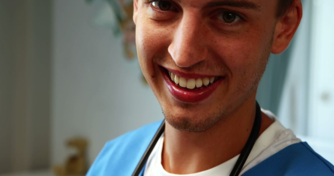 Smiling Young Medical Professional in Scrubs with Stethoscope - Free Images, Stock Photos and Pictures on Pikwizard.com