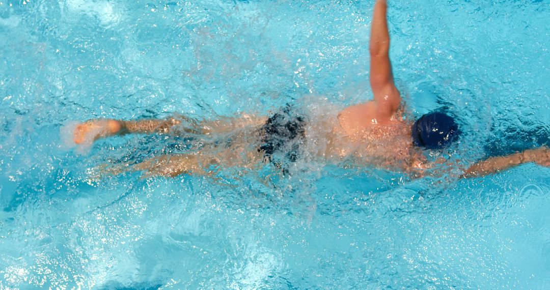 Swimmer Practicing Freestyle Stroke in Crystal Clear Water - Free Images, Stock Photos and Pictures on Pikwizard.com