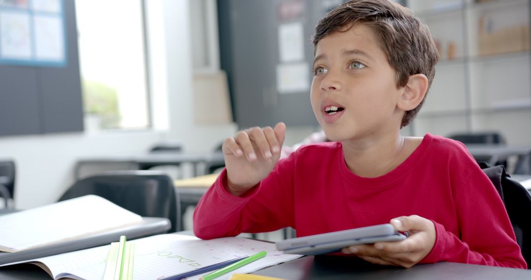 Engaged Student with Tablet Learning in Classroom