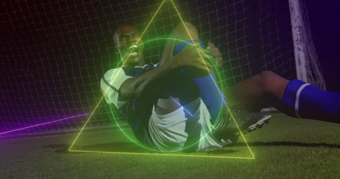Dynamic Soccer Player Injured on Field with Neon Overlay