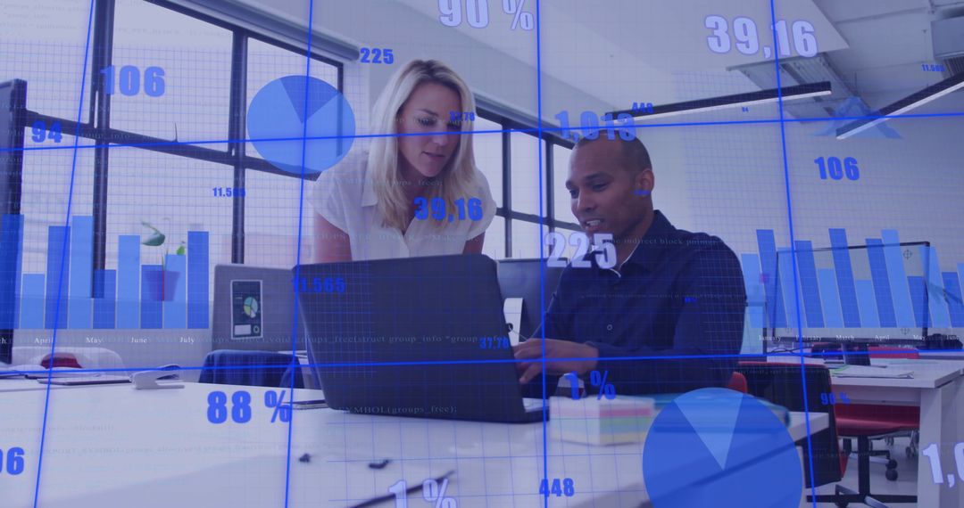 Diverse Colleagues Analyzing Financial Data on Laptop in Modern Office