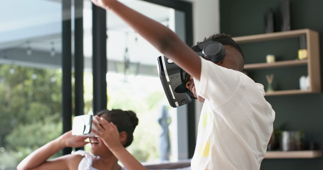 Siblings Enjoying Virtual Reality Technology Together at Home