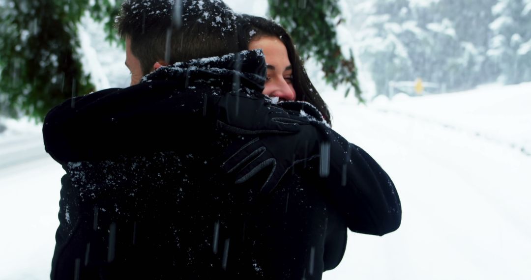 Couple Hugging in Wintery Snowy Forest - Free Images, Stock Photos and Pictures on Pikwizard.com