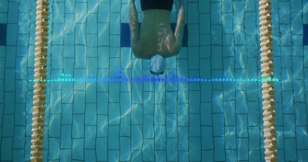 Competitive Swimmer Gliding Through Pool Lane with Dynamic Marker