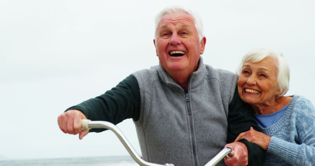 Elderly Couple Enjoying Bike Ride by the Beach - Free Images, Stock Photos and Pictures on Pikwizard.com