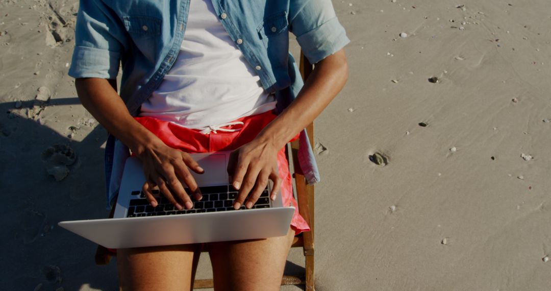 Person Working on Laptop at Beach - Free Images, Stock Photos and Pictures on Pikwizard.com