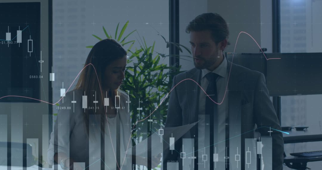 Professionals Analyzing Financial Graphs in Office Setting