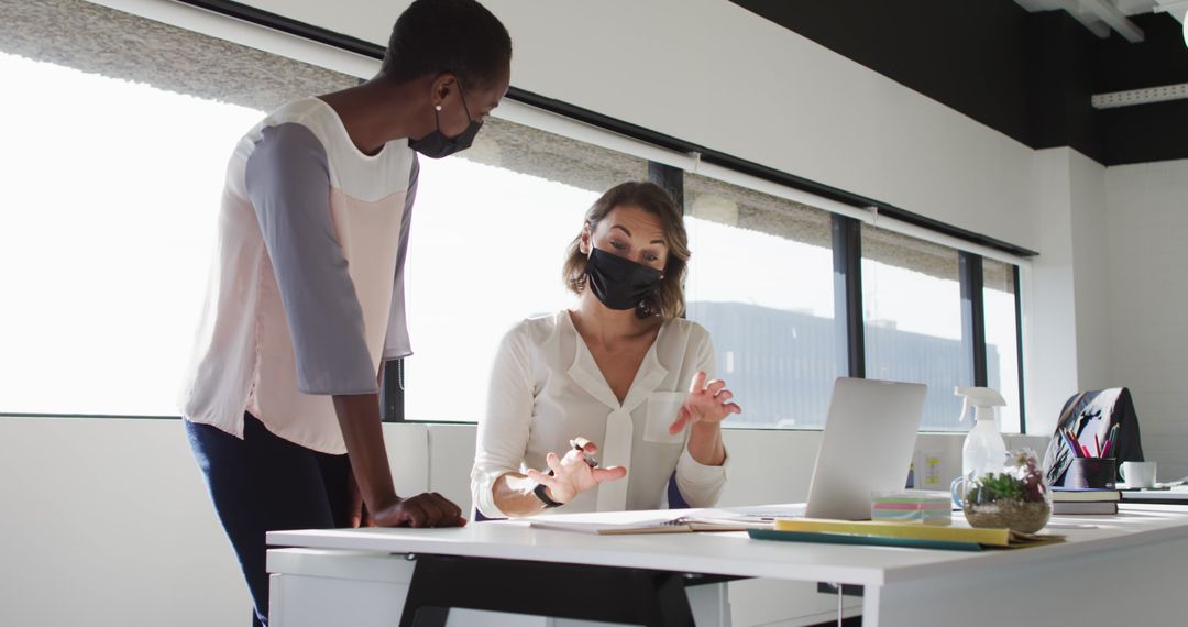 Women Wearing Masks Collaboration in Modern Office - Free Images, Stock Photos and Pictures on Pikwizard.com