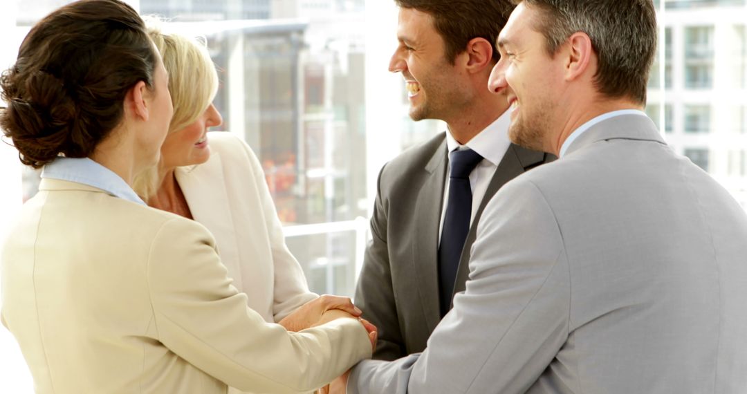 Business Professionals Smiling and Shaking Hands in Office Meeting - Free Images, Stock Photos and Pictures on Pikwizard.com