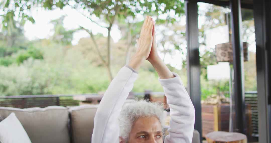 Senior Woman Meditating with Yoga Pose on Patio - Free Images, Stock Photos and Pictures on Pikwizard.com