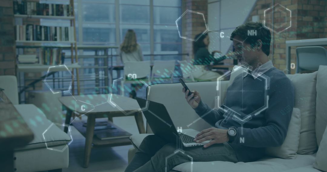 Businessman Using Laptop with Science Technology Overlay