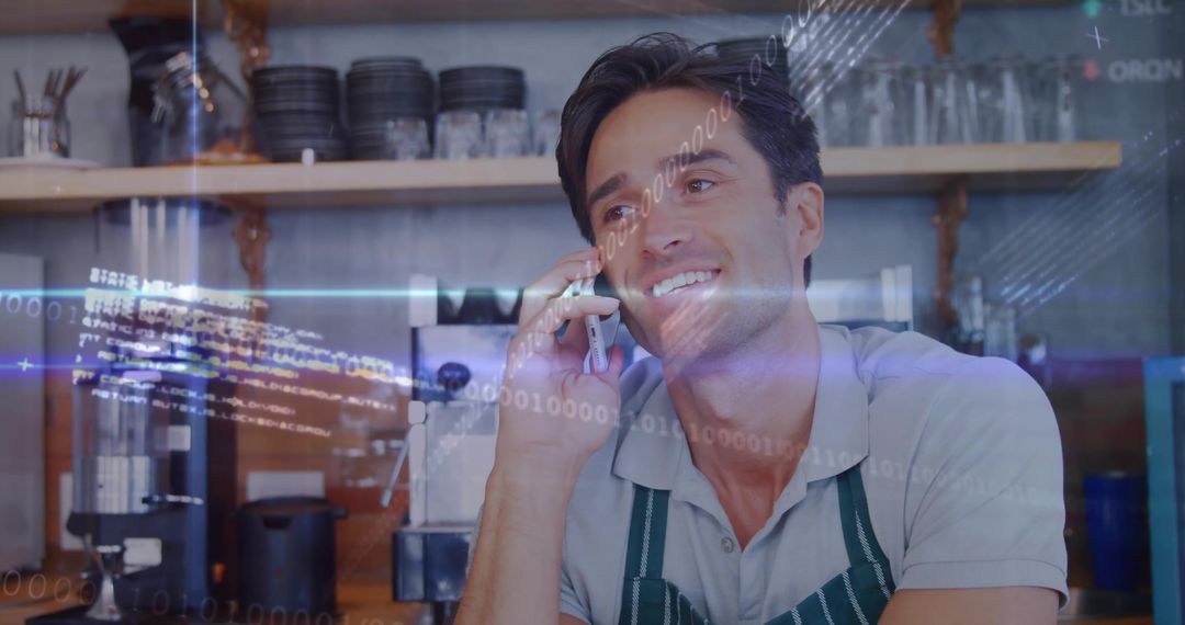 Barista Chatting on Phone While Standing at Coffee Counter