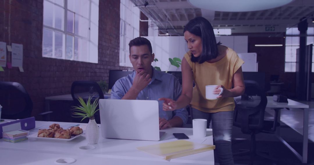 Team Collaborating in Modern Office with Coffee and Pastries
