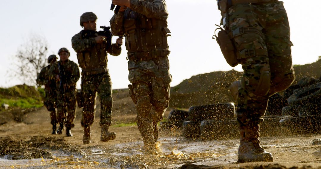 Soldiers Marching Through Muddy Water on Military Training Exercise - Free Images, Stock Photos and Pictures on Pikwizard.com