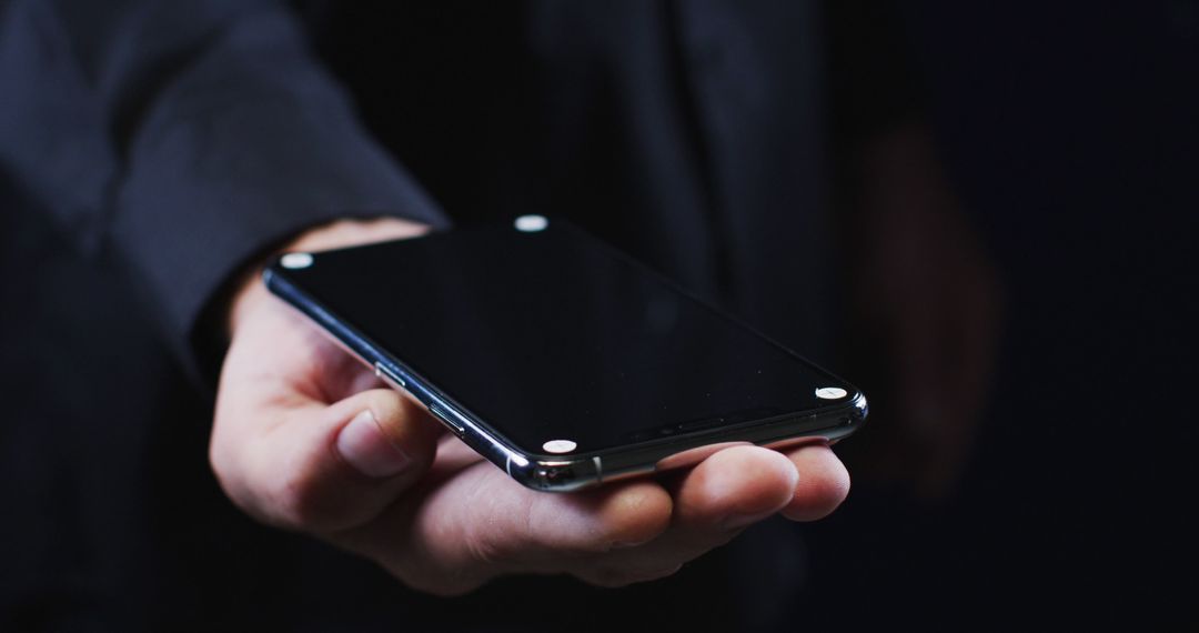 Person Holding Modern Smartphone with Reflective Surface - Free Images, Stock Photos and Pictures on Pikwizard.com