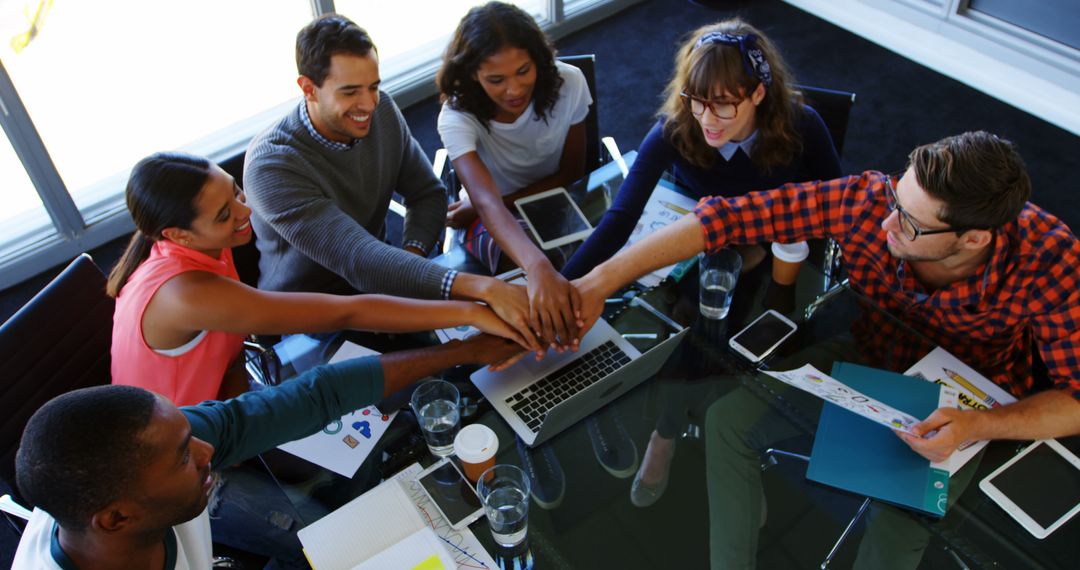 Diverse Team Celebrating Success During Business Meeting - Free Images, Stock Photos and Pictures on Pikwizard.com