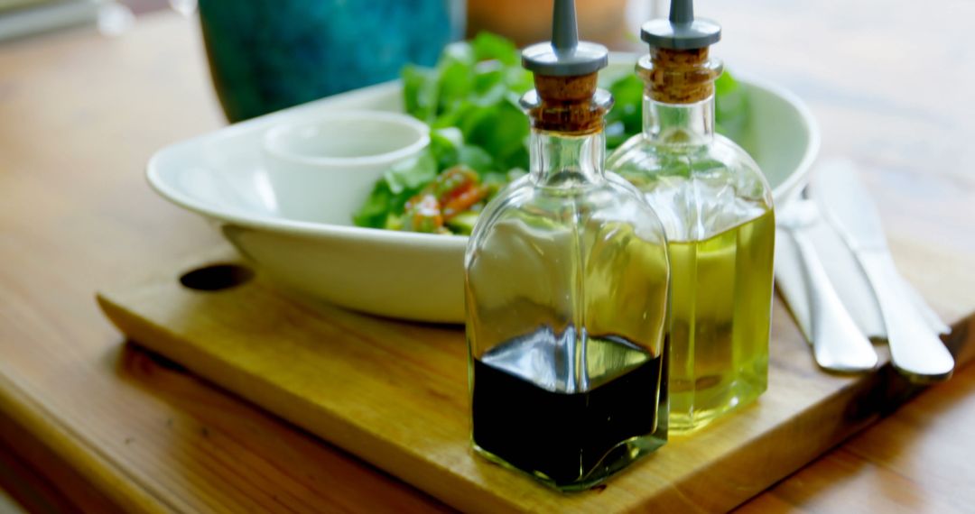 Olive Oil and Vinegar Bottles in Cozy Dining Scene - Free Images, Stock Photos and Pictures on Pikwizard.com