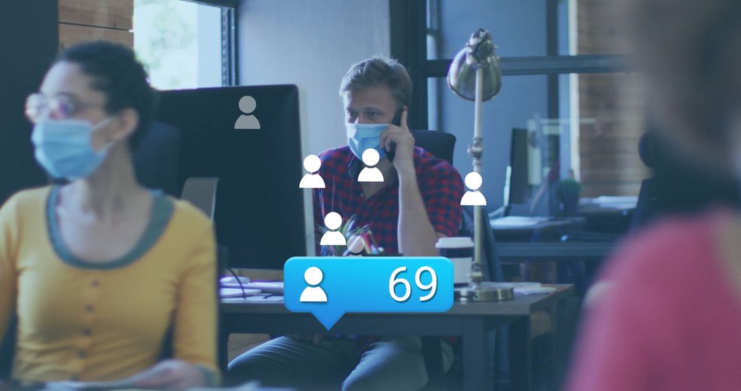 Masked Office Worker in Modern Workspace with Digital Notifications