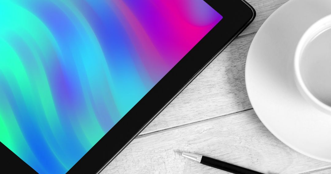 Tablet on Wooden Desk with Colorful Digital Display