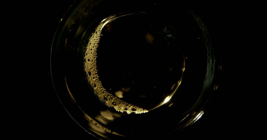 Top View of Glass with Frothy Beer on Dark Background - Free Images, Stock Photos and Pictures on Pikwizard.com