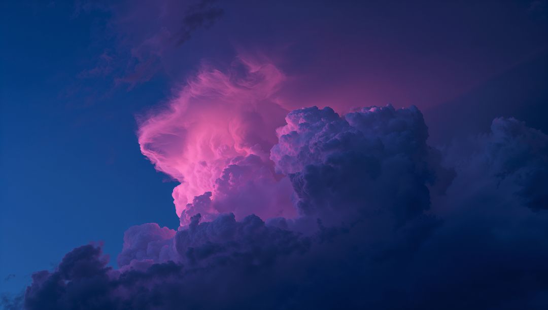 Dramatic Glowing Cumulonimbus Clouds in Pink Purple Twilight