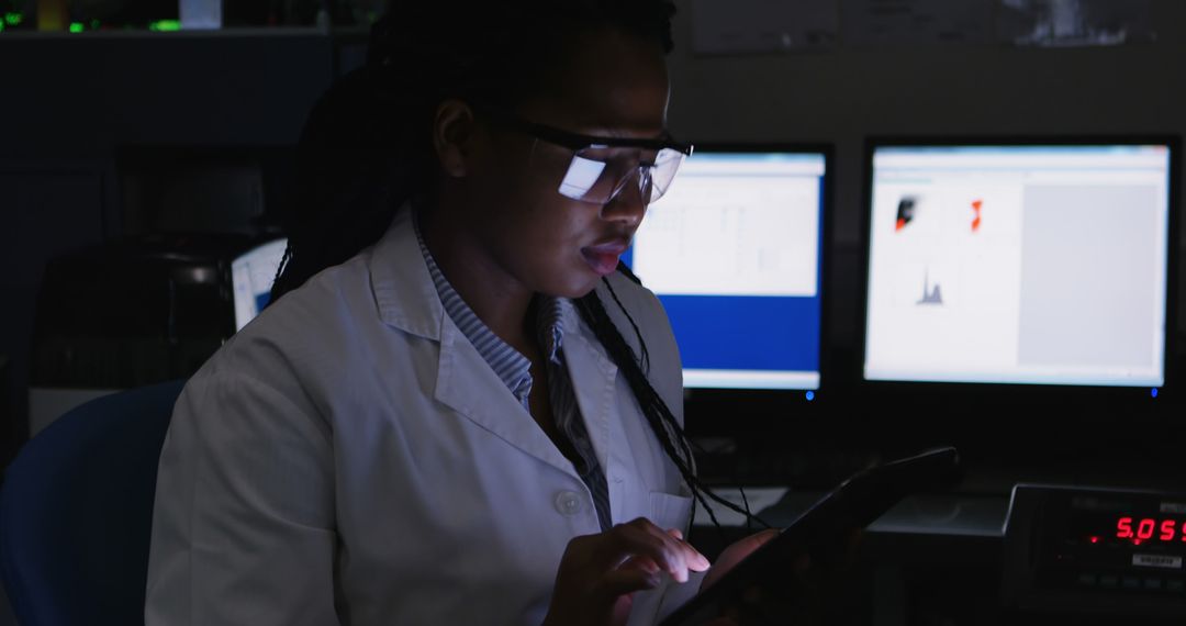 Female Scientist Working on Digital Tablet with Computers in Lab - Free Images, Stock Photos and Pictures on Pikwizard.com