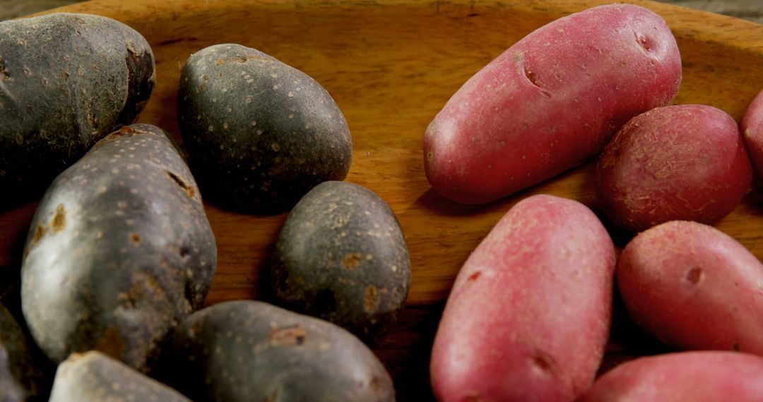 Fresh Purple and Red Potatoes on Wooden Surface - Free Images, Stock Photos and Pictures on Pikwizard.com