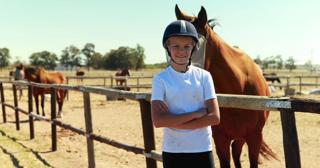 Young Rider Standing in Horse Ranch with Arms Crossed - Free Images, Stock Photos and Pictures on Pikwizard.com