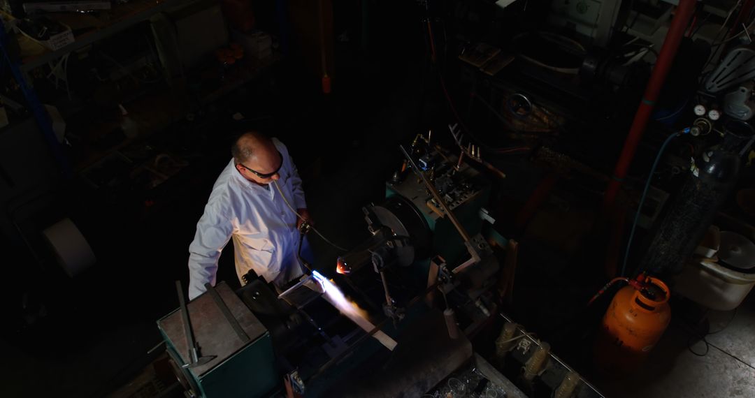 Engineer Working with Blowtorch in Industrial Workshop - Free Images, Stock Photos and Pictures on Pikwizard.com