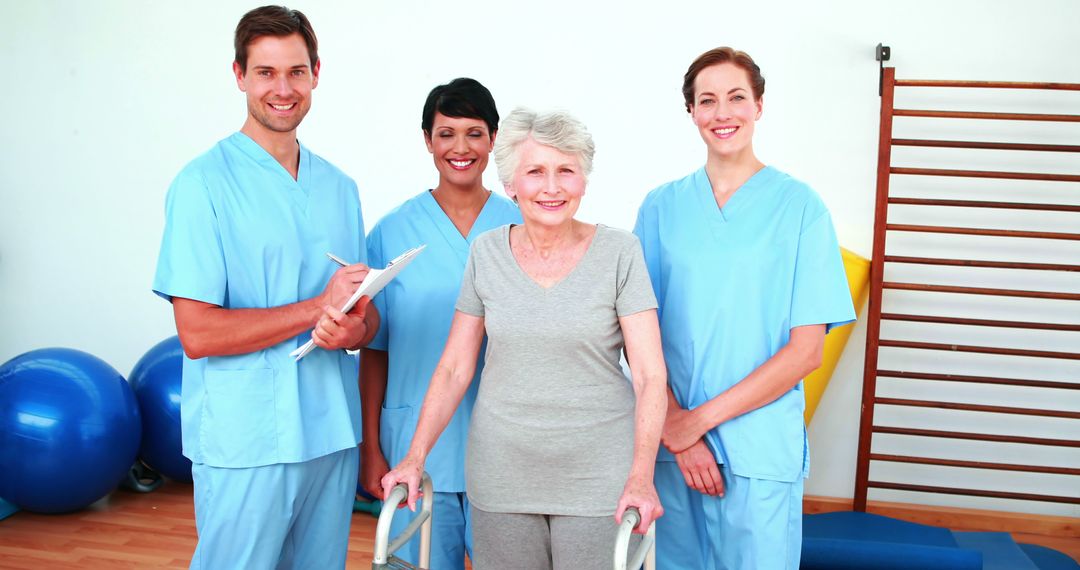 Healthcare Professionals Assisting Elderly Woman in Rehabilitation Center - Free Images, Stock Photos and Pictures on Pikwizard.com