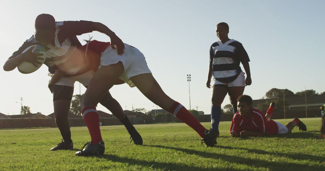 Rugby Players Tackling and Scoring on Sunny Day - Free Images, Stock Photos and Pictures on Pikwizard.com