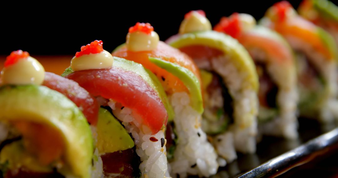 Close-Up of Colorful Sushi Rolls with Avocado, Tuna, and Rice - Free Images, Stock Photos and Pictures on Pikwizard.com