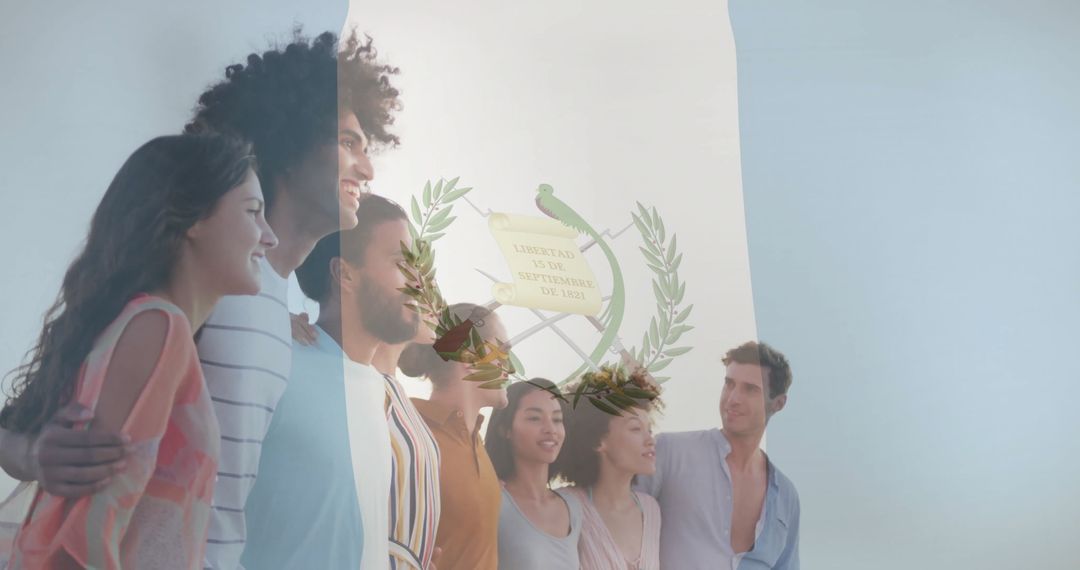 Diverse Group Embracing in Front of Guatemalan National Emblem