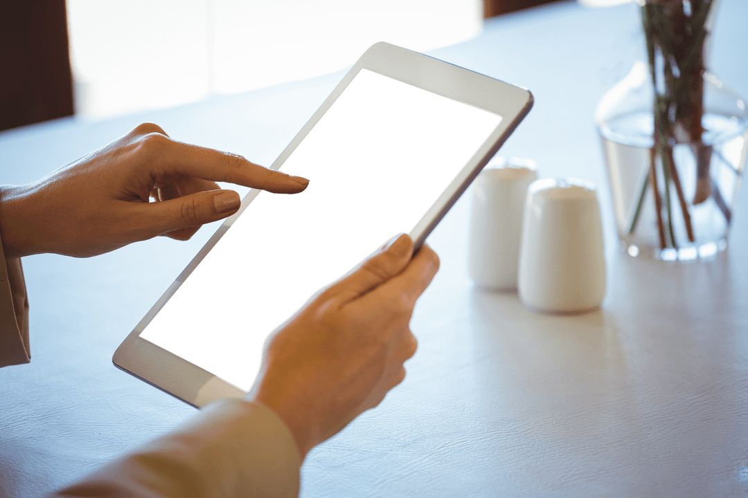Transparent Tablet Screen with Woman's Hands in Café