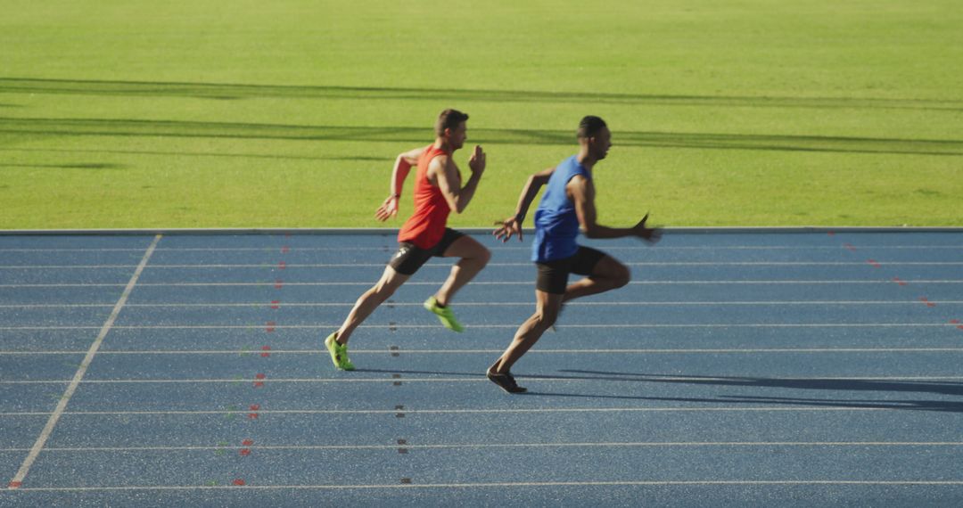 Athletes Sprinting on Track in Competitive Race - Free Images, Stock Photos and Pictures on Pikwizard.com