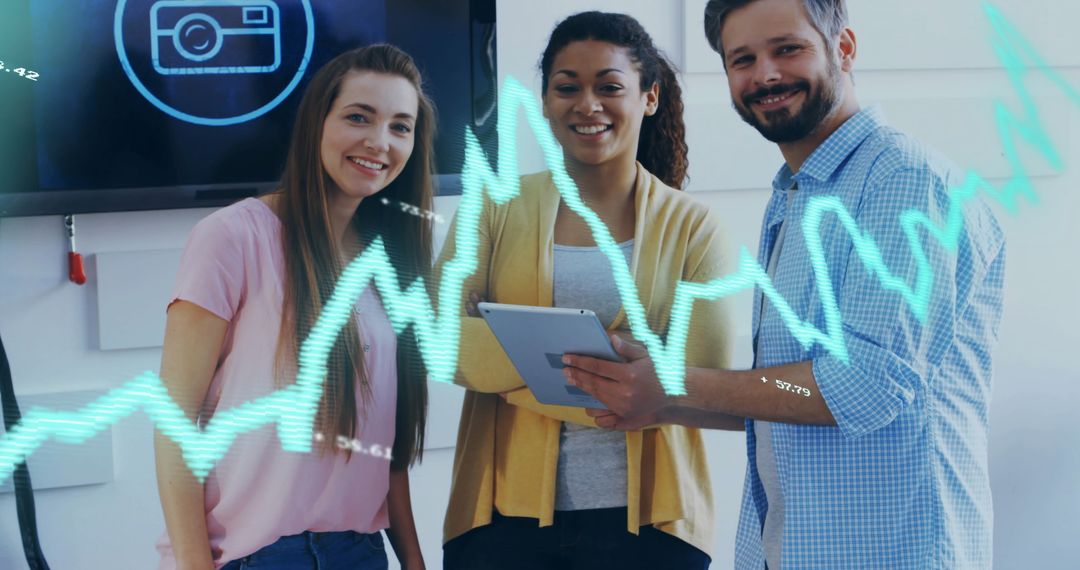 Diverse Team Analyzing Financial Data with Technological Display