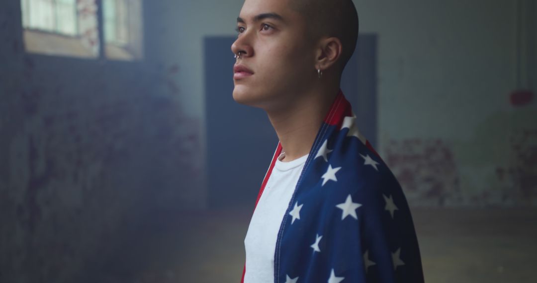 Young Man Wrapped in American Flag Looking Confidently Out - Free Images, Stock Photos and Pictures on Pikwizard.com