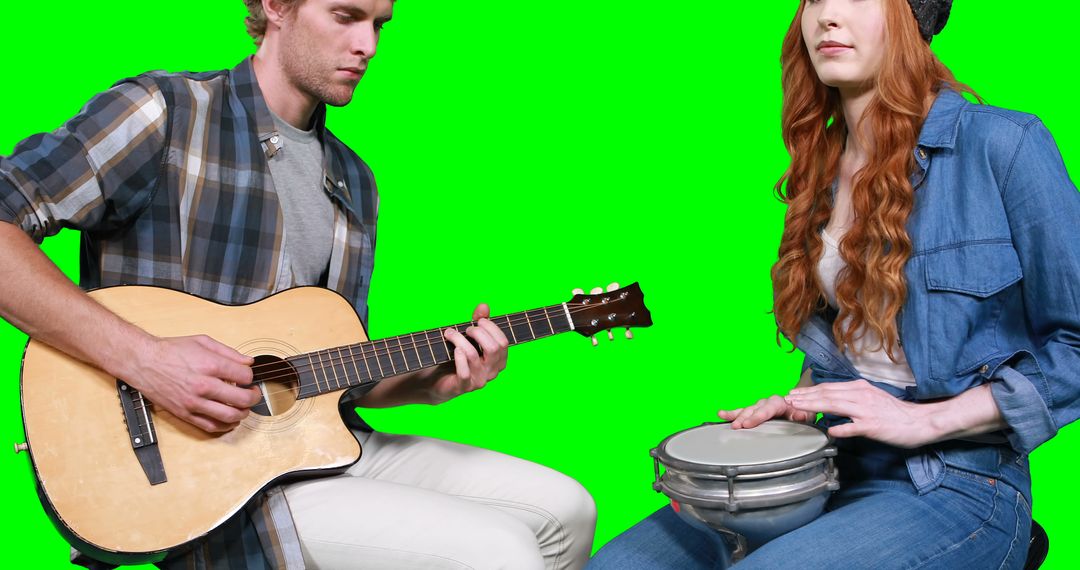 Young Adults Playing Acoustic Guitar and Hand Drum on Green Screen Background - Free Images, Stock Photos and Pictures on Pikwizard.com