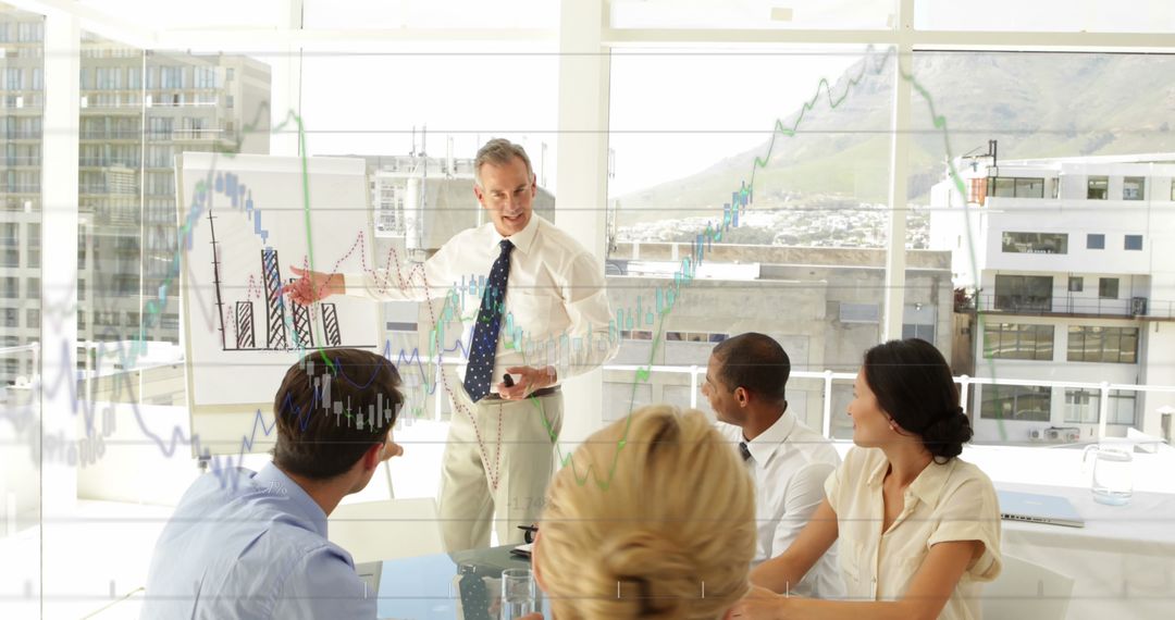 Diverse Business Team Analyzing Financial Graphs in Meeting Room