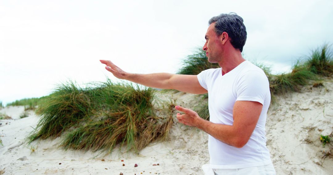 Middle-Aged Man Practicing Tai Chi in Nature - Free Images, Stock Photos and Pictures on Pikwizard.com