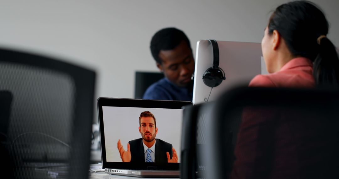 Diverse Professionals Watching Presentation via Video Call