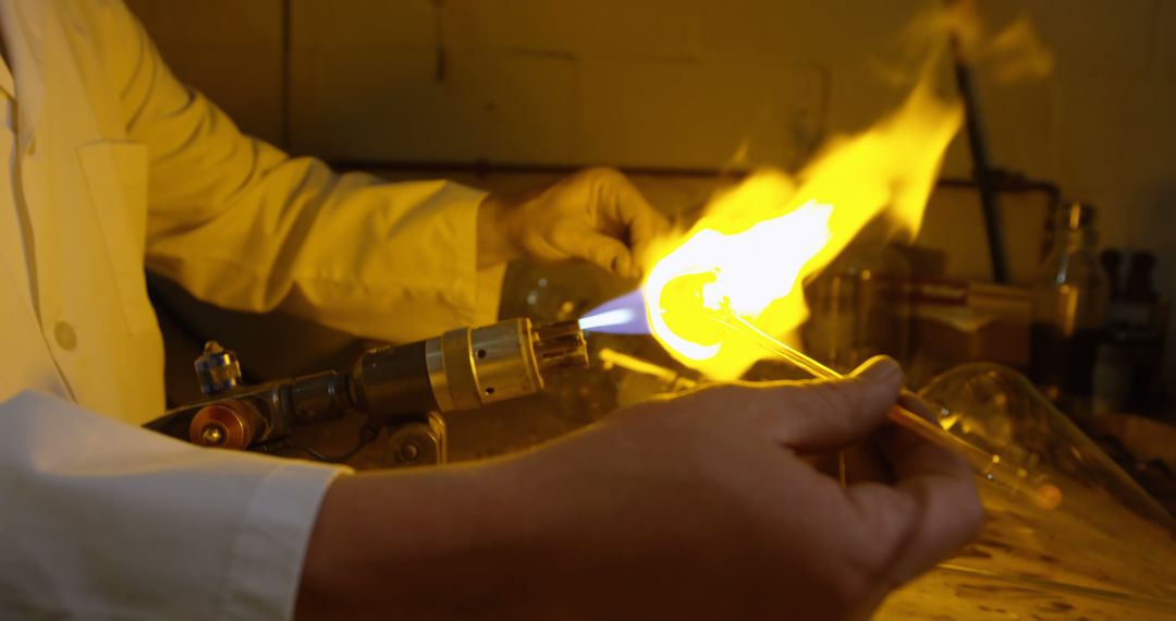 Scientist working with glass in a laboratory setting - Free Images, Stock Photos and Pictures on Pikwizard.com