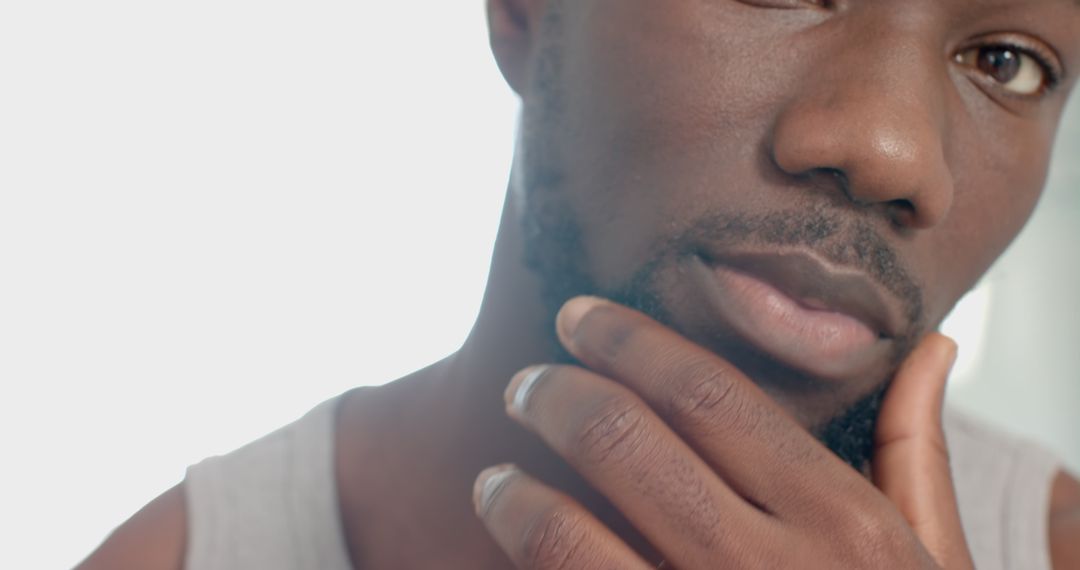 Portrait of a Pensive Man Touching Chin Wearing Silver Ring